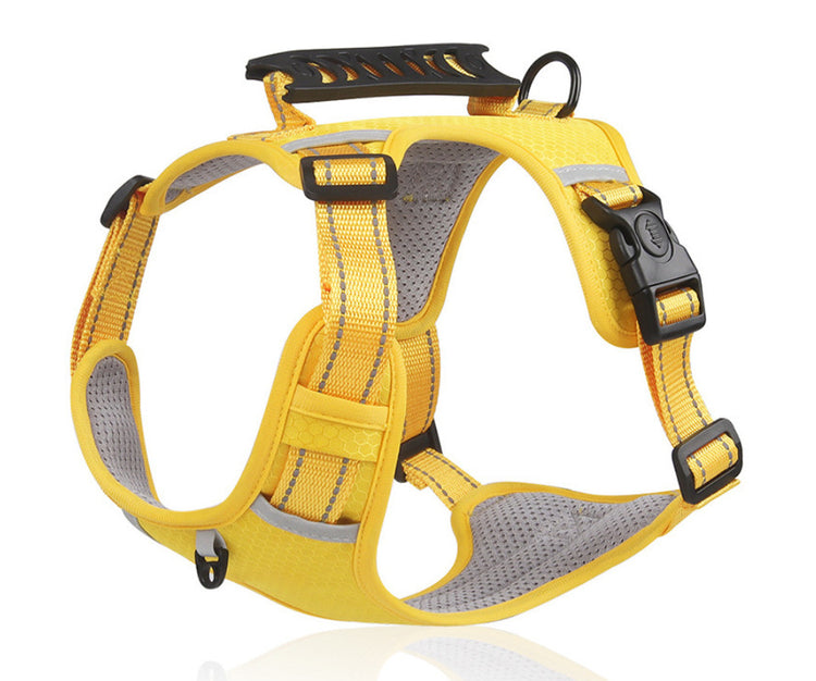 A yellow reflective dog harness with gray mesh padding and black plastic buckles, shown on a white background with a subtle reflection.