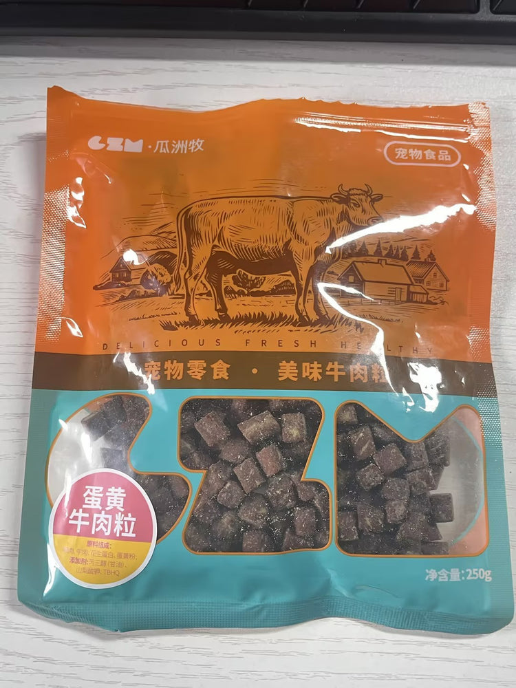 Package of pet food with a cow illustration on an orange and blue background