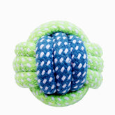 Green and blue knotted fabric ball on a white background