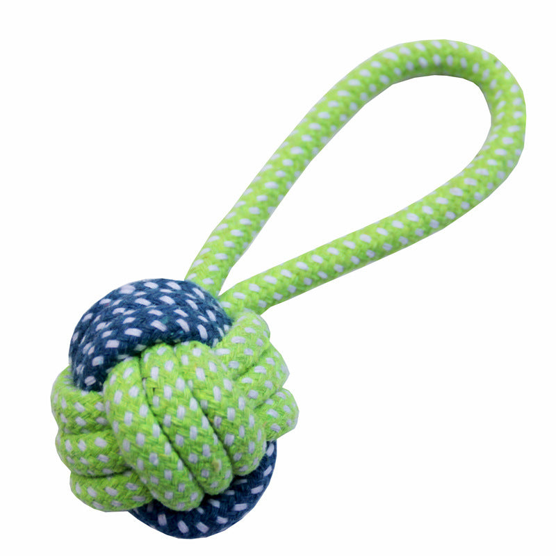 Dog toy with green and blue rope knot on a white background